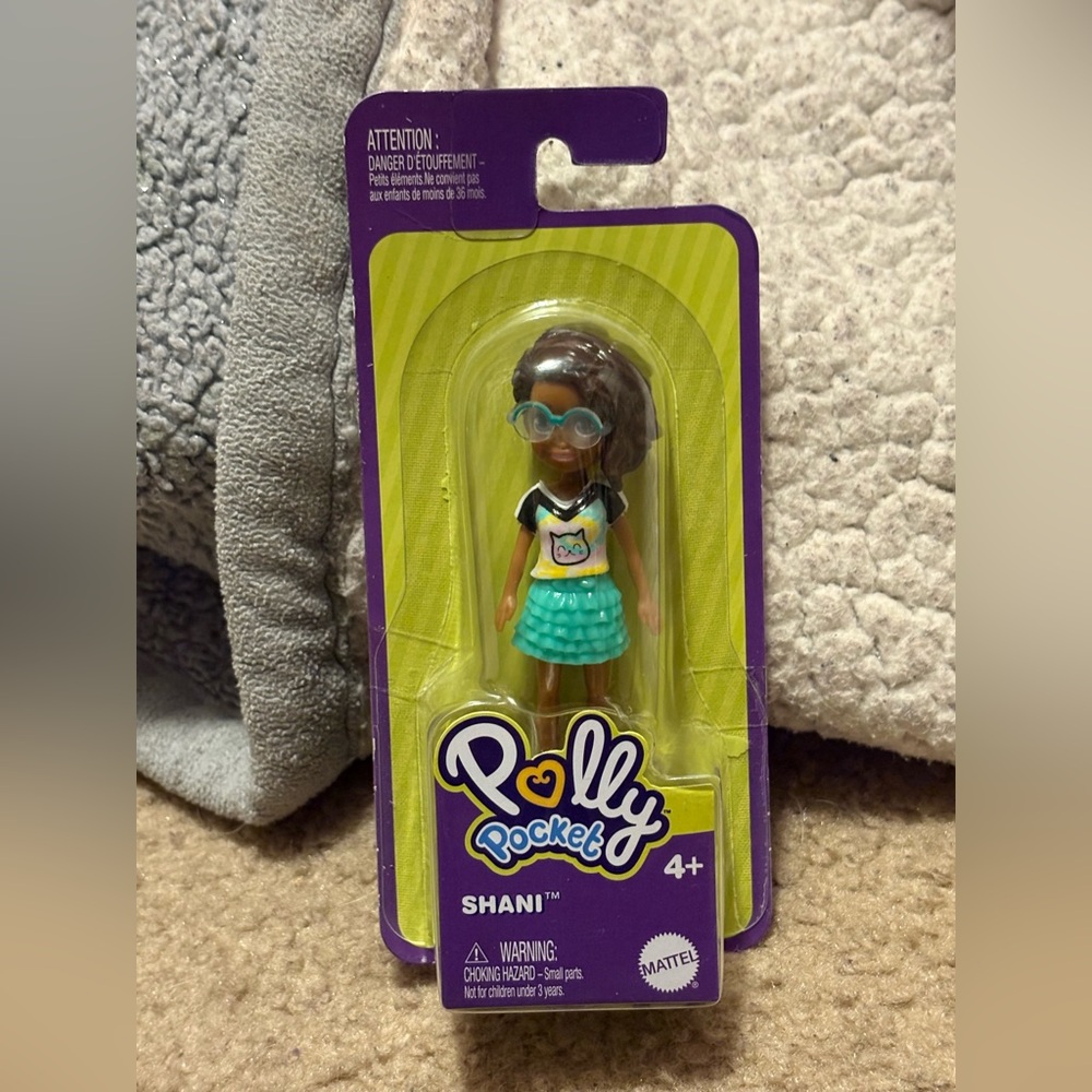 NWT Polly Pocket doll whose name is Shani